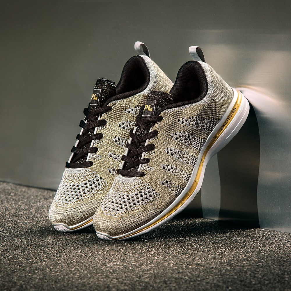 USED apl gold black silver running shoes